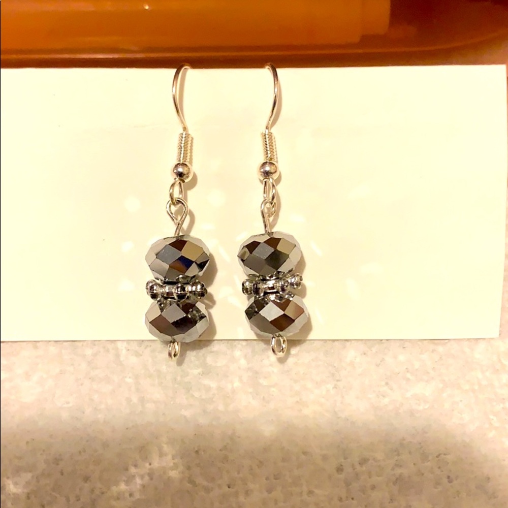 Silver wire beaded earrings.